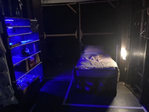 Photo showing arrangement of props trundle and bed truck in the R1 doorway area of stage right during She Loves Me Act 2